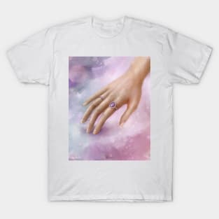 Female Hand With Purple Rings Touching a Soft Purple Fabric T-Shirt